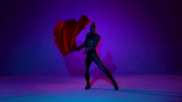 Torero in blue and gold suit or typical spanish bullfighter isolated over on a blue background. Close up, slow motion. — ストック動画