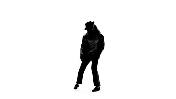 Silhueta de um jovem dançarino dançando com estilo Michael Jackson em fundo branco. Fecha, câmara lenta. . — Vídeo de Stock