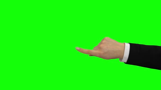 Arm in black jacket indicating at. Green screen. Close up — Stock Video