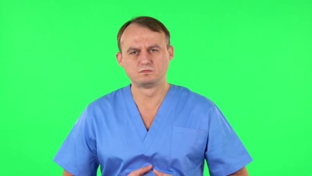 Medical man feels very bad, his stomach hurts. Green screen — Stock Video