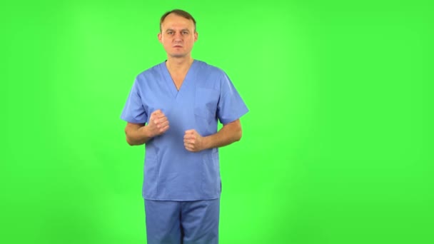 Portrait of annoyed medical man. Green screen — Stock Video