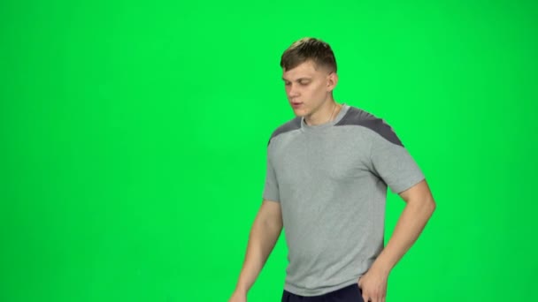 Young male goes then starts to run, waves his hand stand, Chroma Key — Stock Video