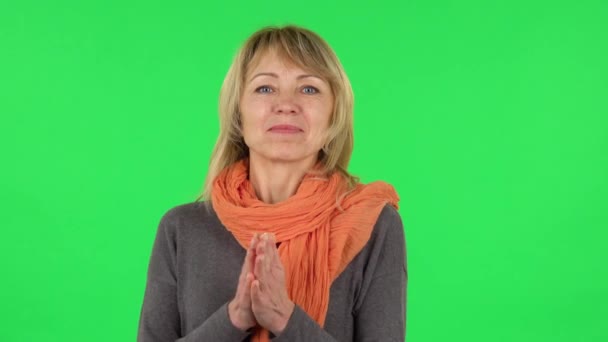 Portrait of middle aged blonde woman is waiting in anticipation with pleasure. Green screen — Stock Video