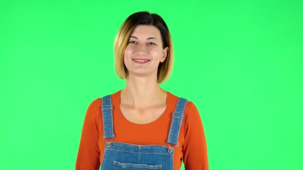 Female bursting with laughter being in positive. Green screen — Stock video