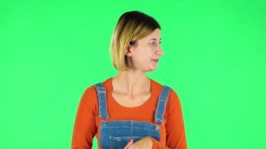 Girl is waiting and angry. Green screen