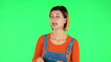 Girl pointing side hand for something then nods and shows thumb like, then pointing other side and shows disapprovingly.