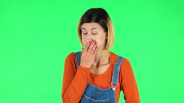 Cute female feels bad, her stomach hurts, feeling nausea. Green screen