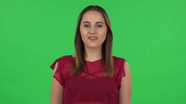 Portrait of tender girl in red dress with wow facial expression and tender smiling. Green screen — Stock video