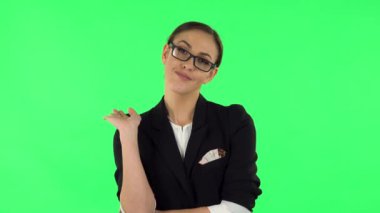 Woman indifferently waving hand and showing gesture come here. Green screen