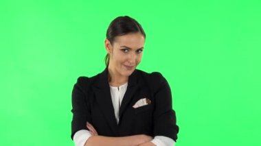 Lovely girl is very offended, looks away and then smiles. Green screen