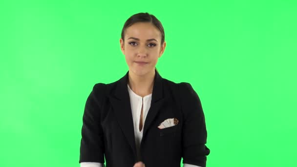 Upset girl looking at the camera with tears in her eyes. Green screen — Stockvideo