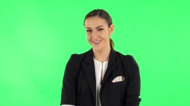 Girl listens carefully then bursts into laughter. Green screen