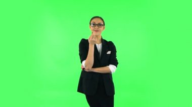 Lovely girl coquettishly smiling, waving hand and showing gesture come here. Green screen