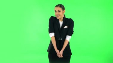 Woman throwing up hands expressing she is innocent, saying oops she doesnt know whats. Green screen