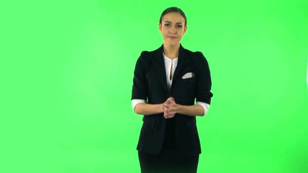 Upset girl looking at the camera with tears in her eyes. Green screen — Stockvideo