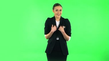 Woman throwing up hands expressing she is innocent, saying oops she doesnt know whats. Green screen