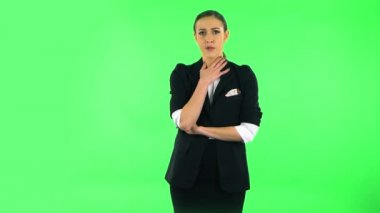 Girl listens to information looking at camera, is shocked and very upset. Green screen