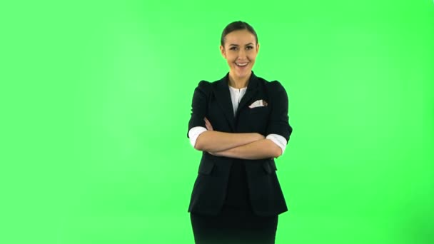 Smiling girl winks and makes sign ok, then thumbs up gesture like. Green screen — 图库视频影像