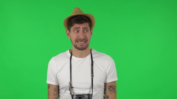 Portrait of confident guy is saying oops and shrugging . Green screen — Stock Video