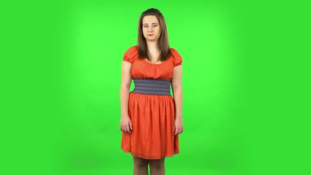 Cute girl smirking into camera, arrogant female. Green screen — Stock Video