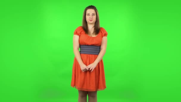 Cute girl worrying in expectation then smile and proud of herself. Green screen — Stock Video