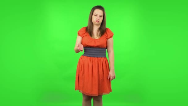 Cute girl cooling herself by her hand, suffering from high temperature weather. Green screen — Stock Video