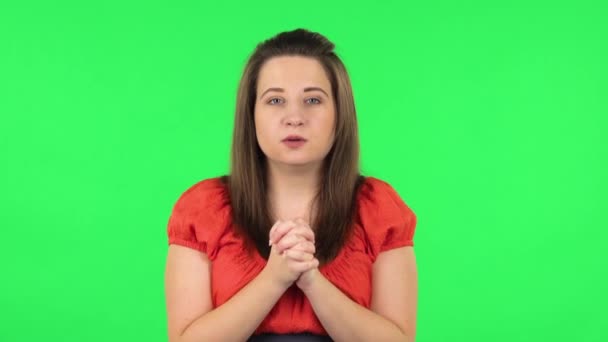 Portrait of cute girl looking at the camera with excitement, then celebrating her victory triumph. Green screen — Stock Video