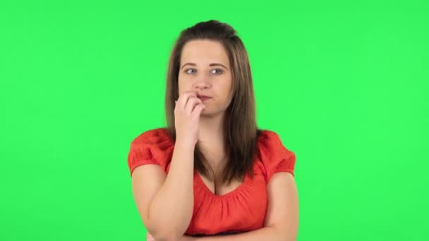 Portrait of cute girl thinking about something, and then an idea coming to her. Green screen — Stock Video