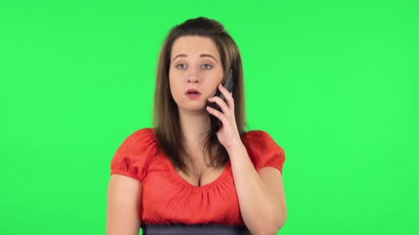 Portrait of cute girl talking for mobile phone. Green screen — Stockvideo