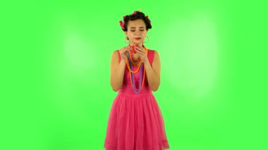 Girl drinks coffee and enjoying on green screen