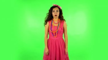 Very surprised girl very happy. Green screen at studio