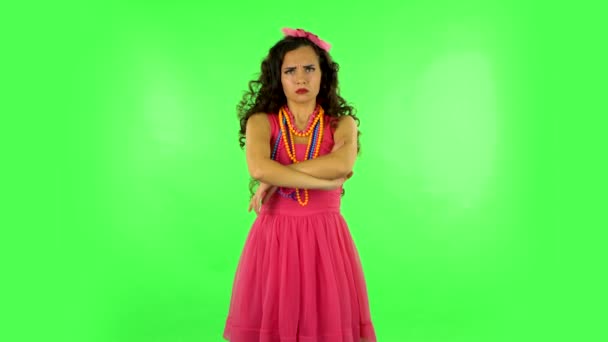 Lovely girl is very offended and looks away. Green screen — Stock Video