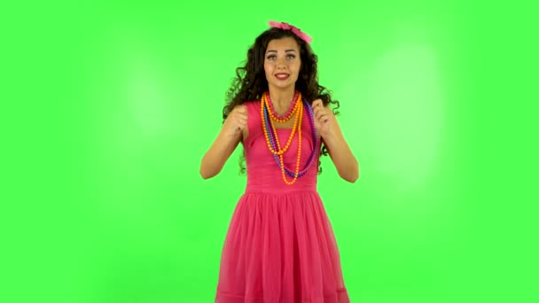 Woman looking at camera with anticipation, then very upset. Green screen — Stock Video