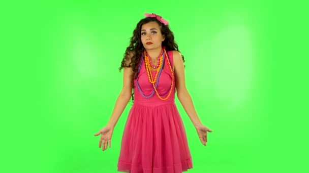 Upset girl shrugs and shakes her head negatively. Green screen — Stock Video