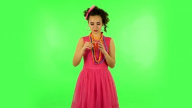 Girl drinks coffee and enjoying on green screen