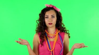 Woman claps his hands with dissatisfaction. Green screen