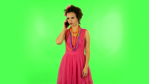 Girl angrily speaks on the phone, proves something. Green screen — Stock Video