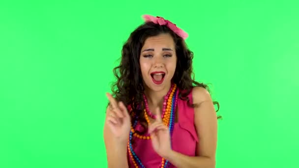 Girl is dancing funny on green screen at studio. — Stok video