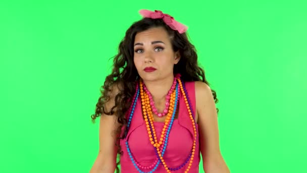 Upset girl shrugs and shakes her head negatively. Green screen — Stock Video