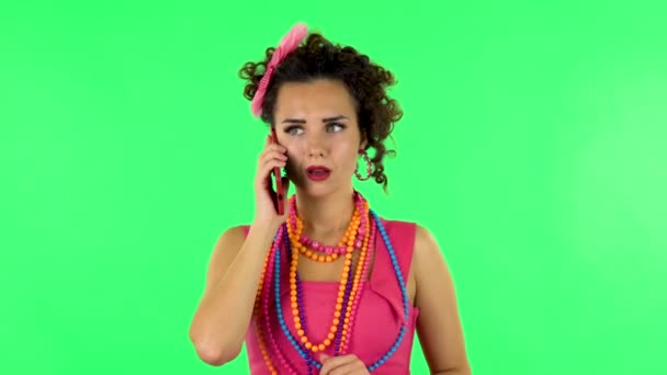 Girl talking for mobile phone, very shocked and rejoices. Green screen — Stock Video