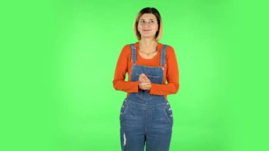 Girl waiting in anticipation with pleasure. Green screen