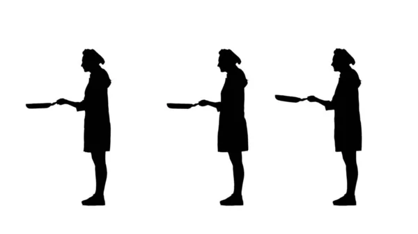 Três silhuetas pretas de chef fêmea em panquecas de assar uniformes . — Fotografia de Stock