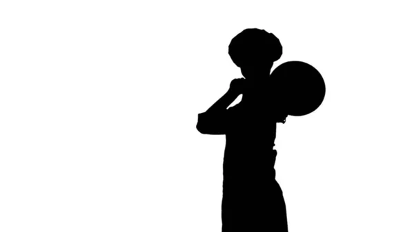 Black silhouette of chef woman is posing with a stewpot. — Stock Photo, Image