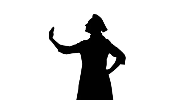 Retrato de cocinera de silueta negra en toque gesticulando alabando sus platos sobre fondo blanco. Vista del perfil — Foto de Stock