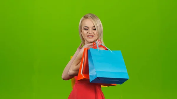 Happy shopping woman excited and cheerful. Green screen studio — Stock Photo, Image