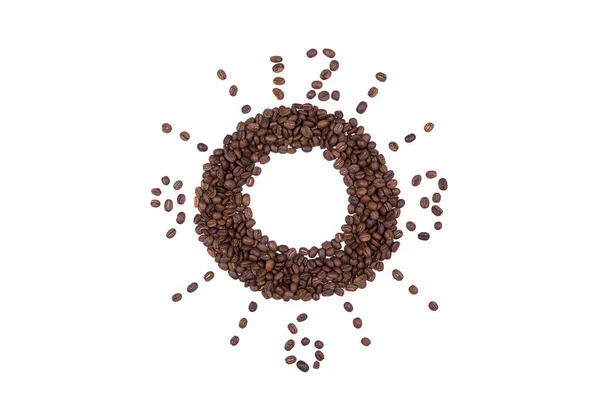 Kaffebønner som samles inn er lagt ut i en sirkel med tall som symboliserer klokken isolert på hvit bakgrunn. . – stockfoto