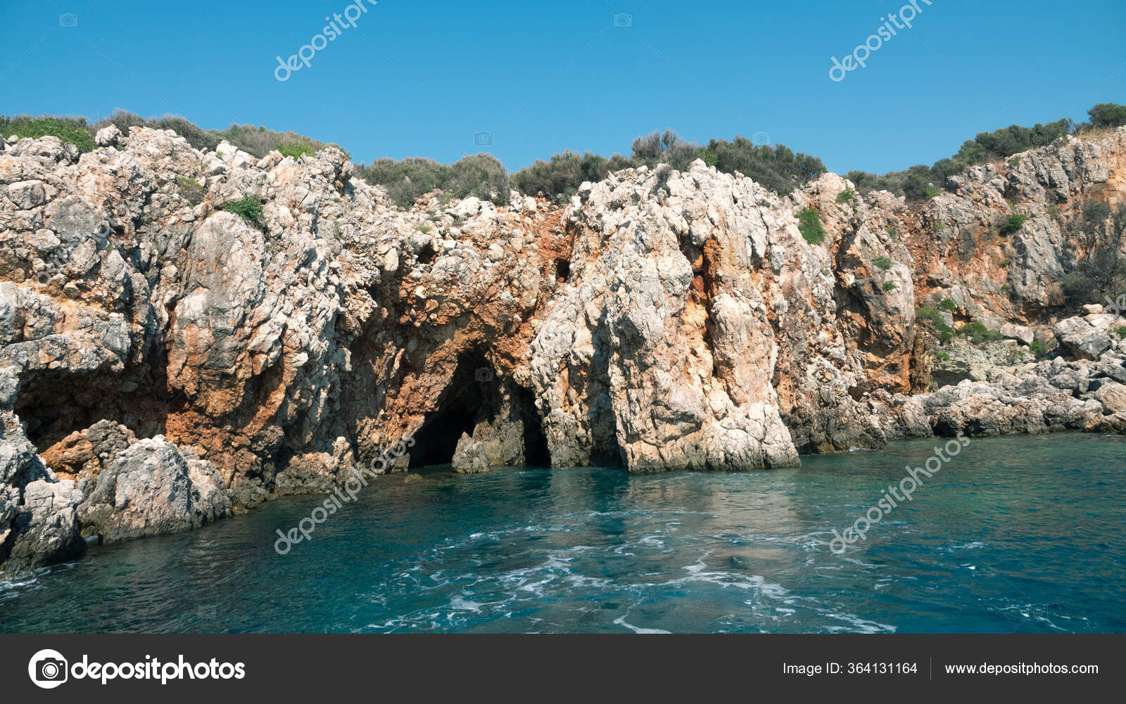 Beautiful deep sea with small waves and steep cliffs on the shores