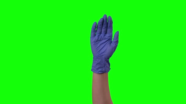 Doctors female hand in blue glove is waving welcoming you and gesturing come here at green screen. Close up motion. — Stock Video