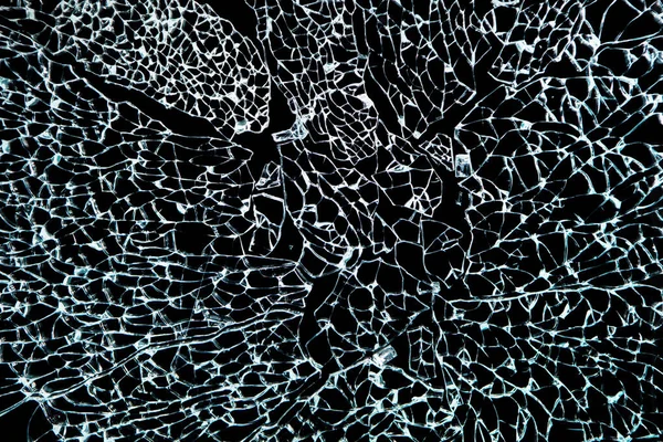 Close-up de vidro quebrado, vidro temperado quebrado no fundo preto — Fotografia de Stock