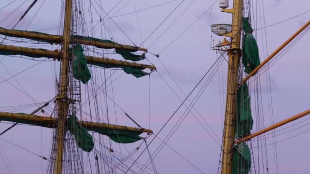 Mast of sailing ship with folded sails, rigging and ropes — Stock Video